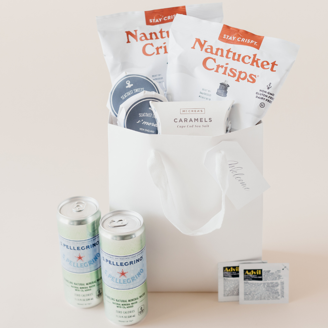 Pre-filled wedding welcome bag with Nantucket Crisps, Seacoast Sweets, McCrea’s caramels, San Pellegrino, and Advil – curated hotel guest gift by Lavender + Pine