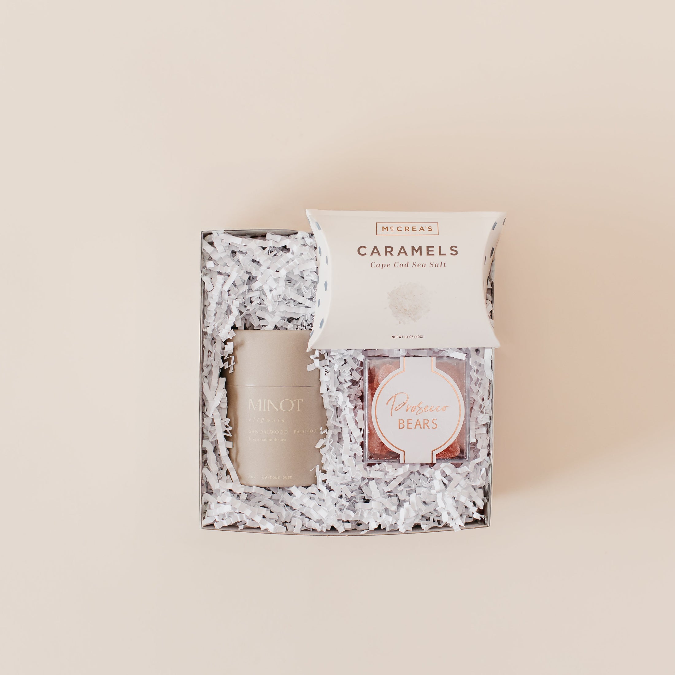 Lavender and Pine Bubbly and Glow Gift Box featuring Minot Cliffwalk candle, Prosecco Bears, and McCrea's Cape Cod sea salt caramels add on in mini white tuck top gift box