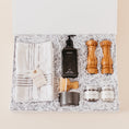 Load image into Gallery viewer, Lavender and Pine Kitchen Essentials Gift Box featuring Monaco kitchen towels, Homecourt Cece dish soap, dish brush set, Natural OliveWood salt and pepper mills, and La Boite Tellicherry pepper and grey salt in white magnetic gift box

