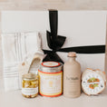 Load image into Gallery viewer, Lavender and Pine Pizza Night Gift Box front view featuring Le Marké olive oil, Bella Cucina pizza and focaccia mix, Bella Cucina pomodoro pizza sauce, French Farm L'Epicurien sweet garlic and herbs, stainless garlic rocker, and Kaf Home striped kitchen towel set in white magnetic gift box

