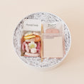 Load image into Gallery viewer, Lavender and Pine Desktop Edit gift box featuring Scandy Candy Swedish candy, Touchland Rosewater Glow Mist, gold pen, and cream tabbed sticky notes in white round gift box
